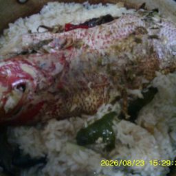 Asian Broiled Or Baked In Oven Whole Fish With Rice Shitake Mushrooms And Wakeme Seaweed